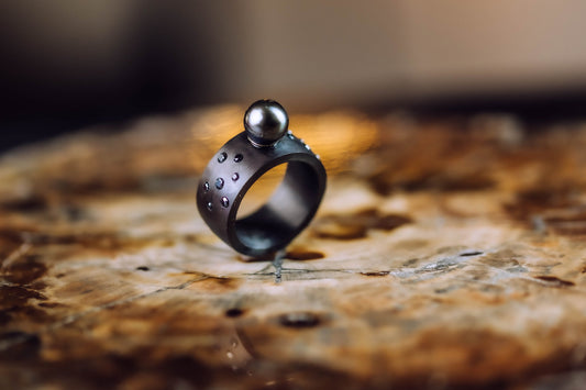 carbon, yellow gold, tahitian pearl, black diamonds